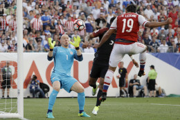 United States' Brad Guzan, left, blocks a shot by Paraguay's Dario Lezcano, right, during the first half of a Copa America Group A soccer match Saturday, June 11, 2016, in Philadelphia. (AP Photo/Matt Slocum)