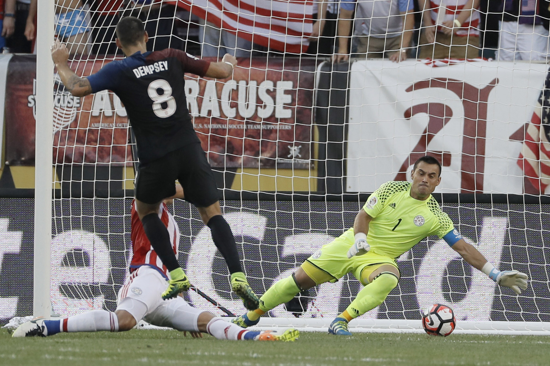 United States' Clint Dempsey, center, scores a goal past Paraguay's Justo Villar, right, and Fabian Balbuena during the first half of a Copa America Group A soccer match Saturday, June 11, 2016, in Philadelphia. (AP Photo/Matt Slocum)