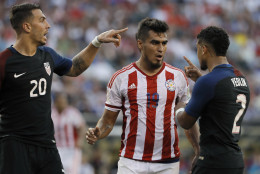 United States' Geoff Cameron, left, and DeAndre Yedlin, right, argue with Paraguay's Dario Lezcano after a tackle during the first half of a Copa America Group A soccer match Saturday, June 11, 2016, in Philadelphia. United States won 1-0. (AP Photo/Matt Slocum)