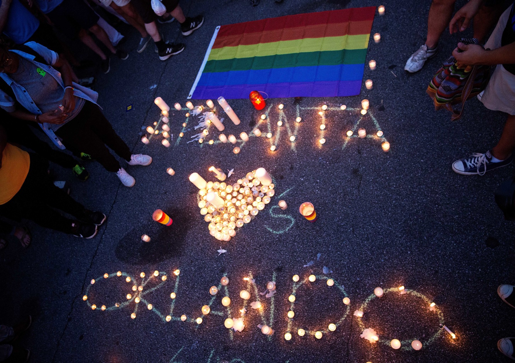 A message spelled out in candles is laid out at a vigil after a fatal shooting at an Orlando nightclub, Sunday, June 12, 2016, in Atlanta. (AP Photo/David Goldman)
