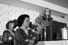 ADVANCE FOR USE MONDAY, JUNE 20, 2016 AND THEREAFTER -FILE - In this Nov. 21, 1979 file photo, Bella Abzug, left, and Patsy Mink of Women USA sit next to Gloria Steinem as she speaks in Washington where they warned presidential candidates that promises for women's rights will not be enough to get their support in the next election. (AP Photo/Harvey Georges)