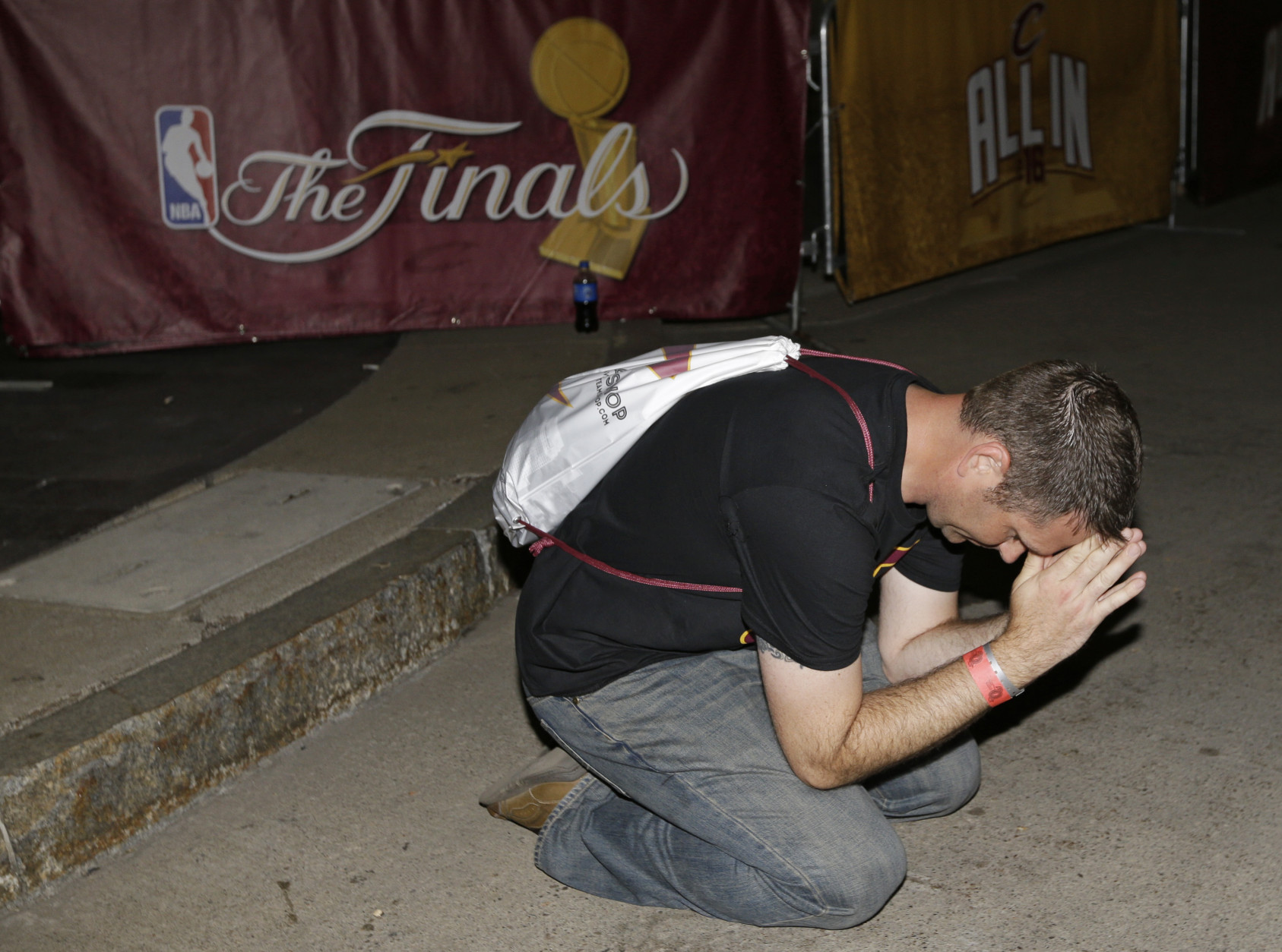 Brian Wilson prays in the final minutes of Game 7 of the NBA basketball Finals between the Cleveland Cavaliers and the Golden State Warriors, Sunday, June 19, 2016, in Cleveland. The Cavaliers won 93-89. (AP Photo/Tony Dejak)