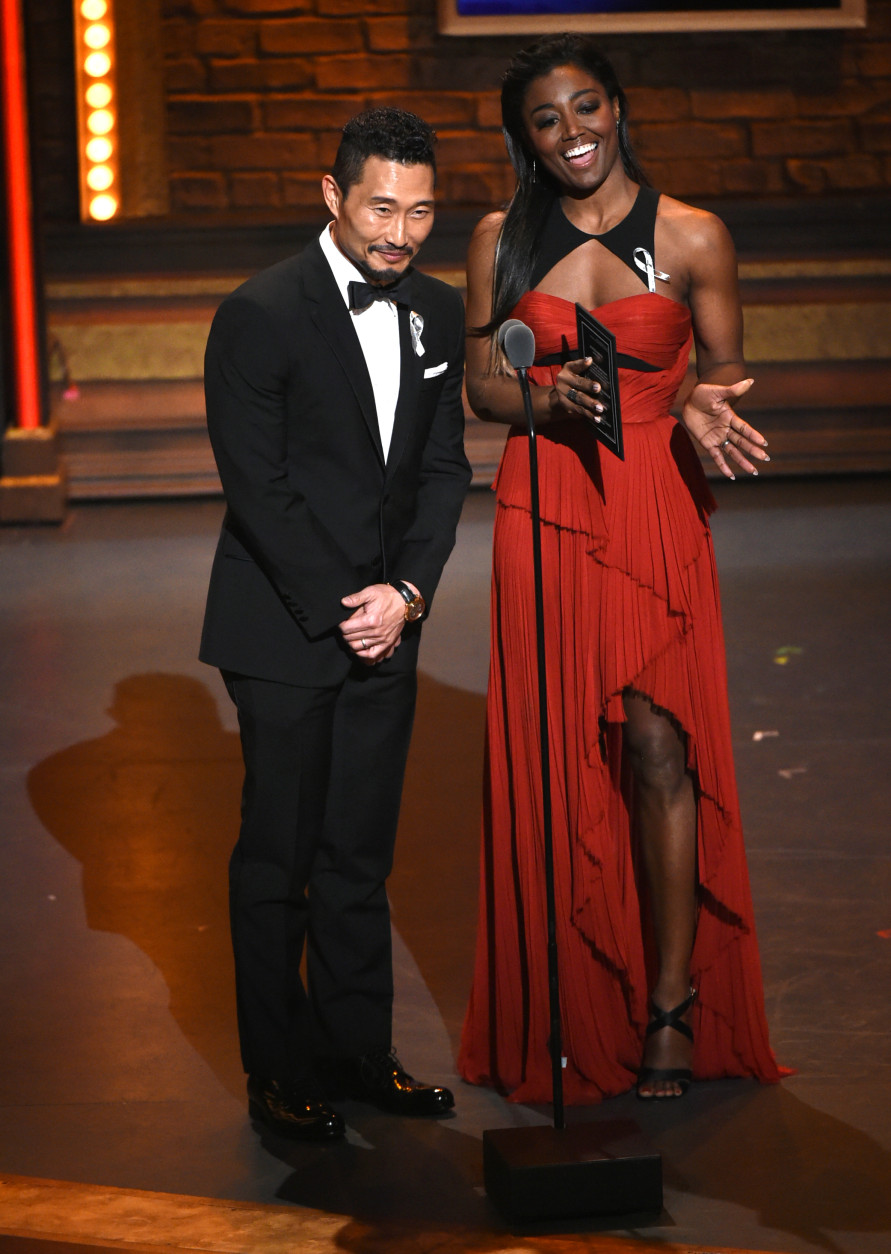 Daniel Dae Kim, left, and Patina Miller present the award for featured actor in a musical at the Tony Awards at the Beacon Theatre on Sunday, June 12, 2016, in New York. (Photo by Evan Agostini/Invision/AP)
