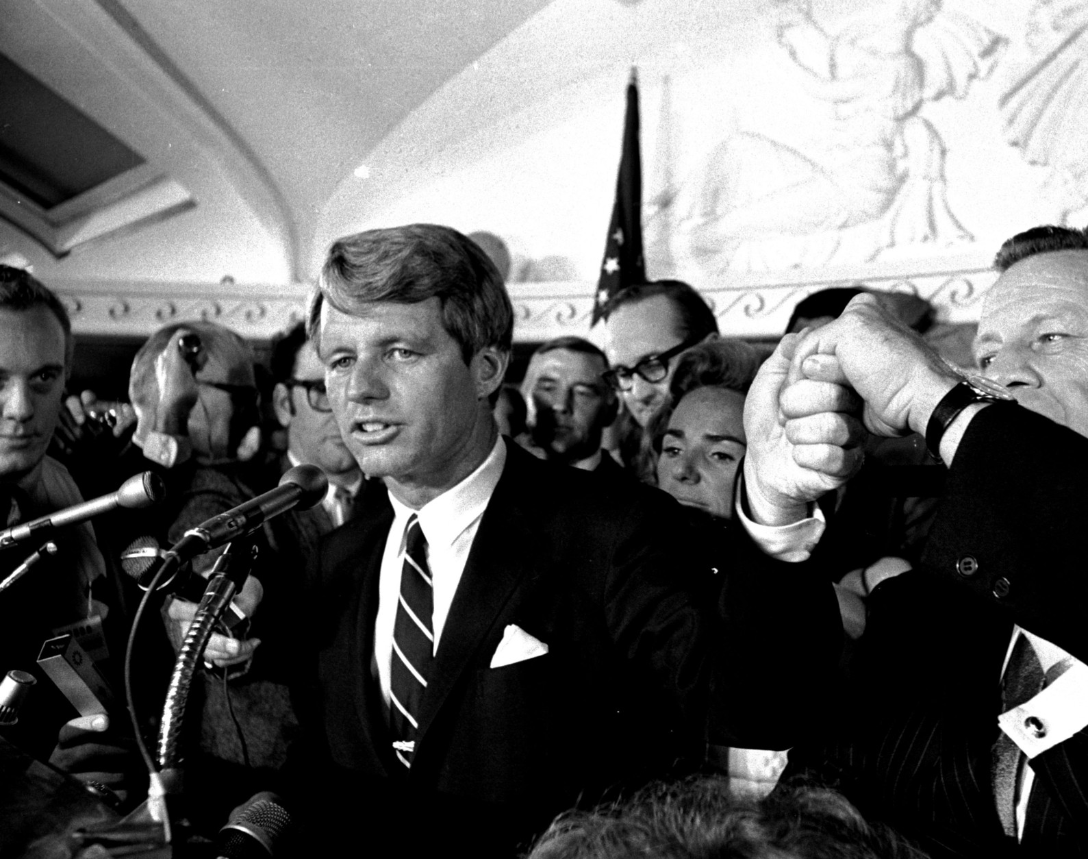 Sen. Robert F. Kennedy addresses a throng of supporters in the Ambassador Hotel in Los Angeles early in the morning of June 5, 1968, following his victory in the previous day's California primary election.  A moment later he turned into a hotel kitchen corridor and was critically wounded.  His wife, Ethel, is just behind him.  (AP Photo/Dick Strobel)