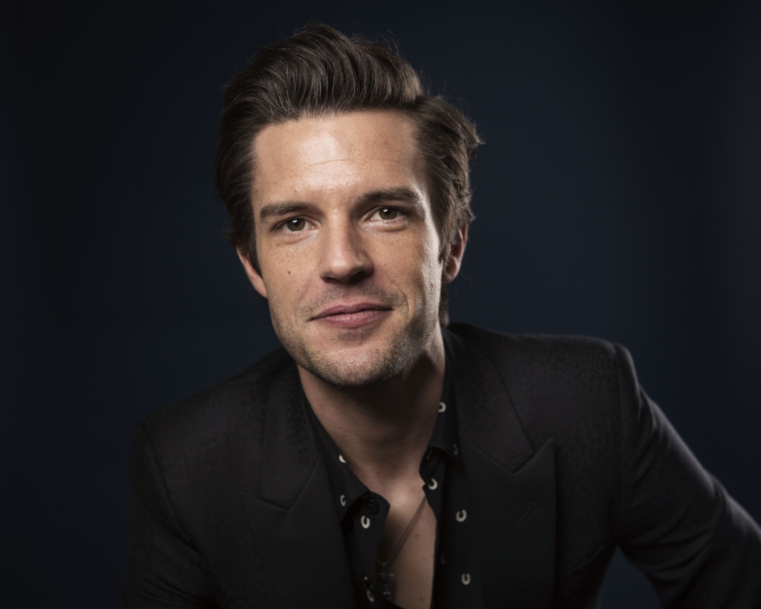 In this March 24, 2015 photo, musician Brandon Flowers poses for a portrait in New York. Flowers, the frontman of the rock band The Killers, is releasing a solo album, "The Desired Effect."  (Photo by Taylor Jewell/Invision/AP)