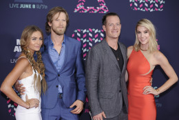 Members of Florida Georgia Line, Brian Kelley, from second left, and Tyler Hubbard are joined by Brittany Marie Cole, left, and Hayley Stommel as they arrive at the CMT Music Awards at the Bridgestone Arena on Wednesday, June 8, 2016, in Nashville, Tenn. (Photo by Sanford Myers/Invision/AP)