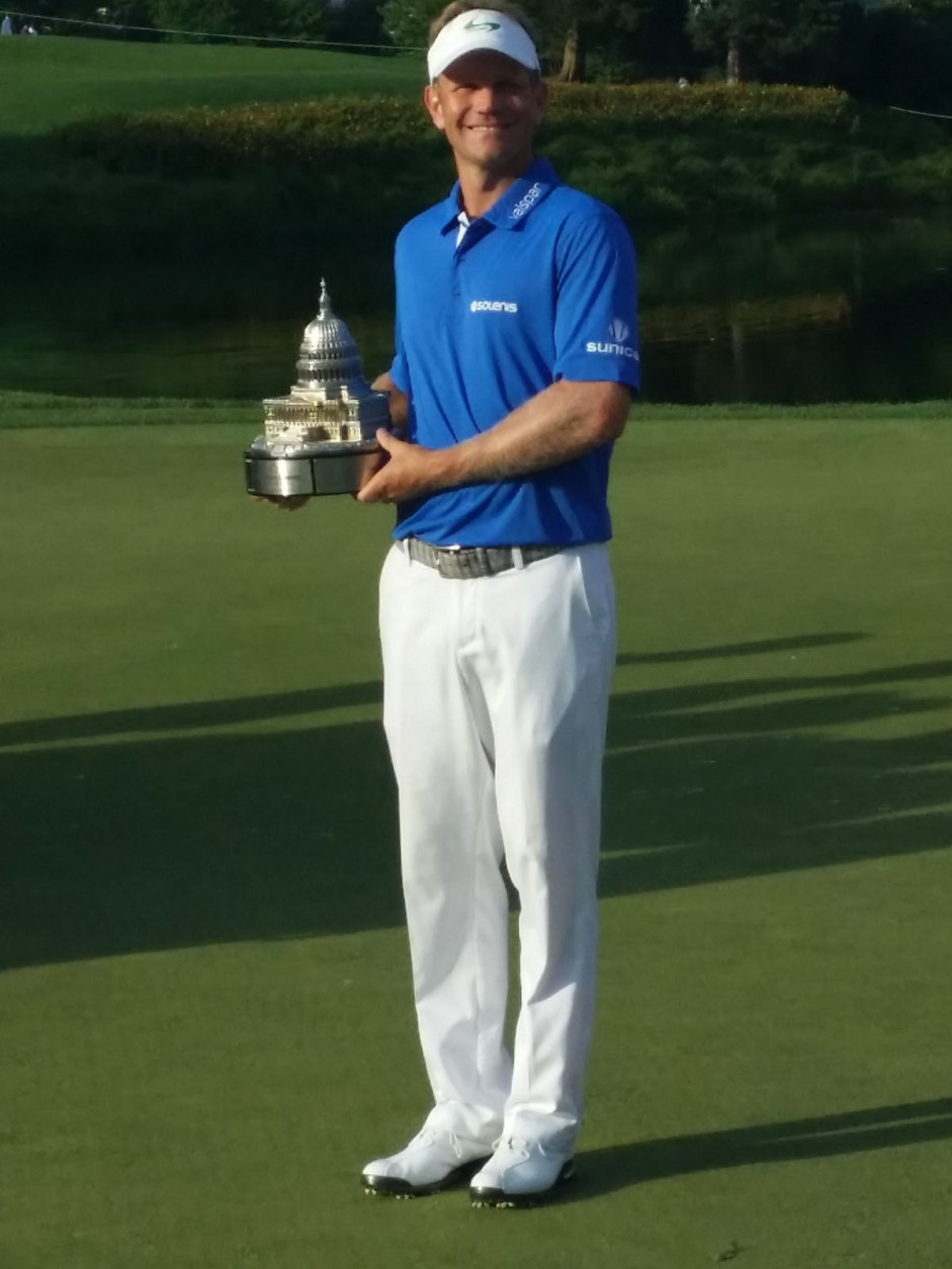 Billy Hurley III stands with his winning trophy. (WTOP/J. Brooks)
