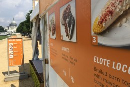 At Rollo's Tacos tent the Elote loco is broiled corn topped with mayonnaise, butter, Mexican cheese, and chili powder. (WTOP/Kristi King)