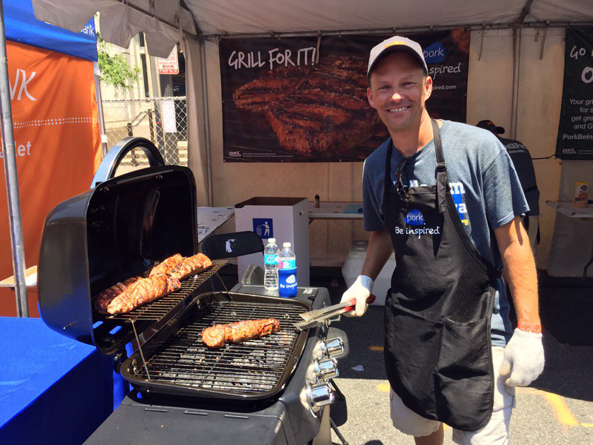 Aaron Cook of Winthrop, Iowa, grills up some pork samples at the Giant National Capital Barbecue Battle on Saturday in D.C. (WTOP/Kristi King)