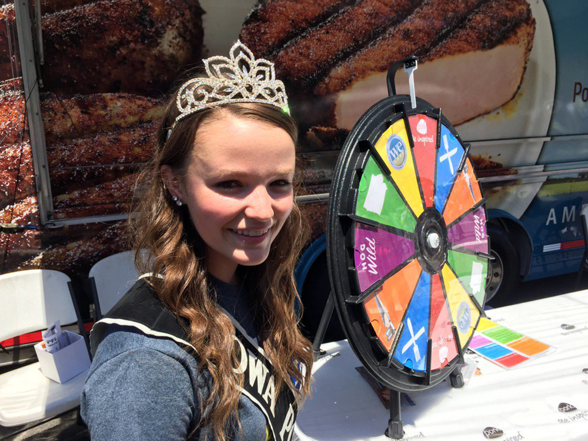 The reigning Iowa Pork Queen, 18-year-old Holly Cook, attends the Giant National Capital Barbecue Battle. Cook is going to Iowa State University for agriculture business. (WTOP/Kristi King)