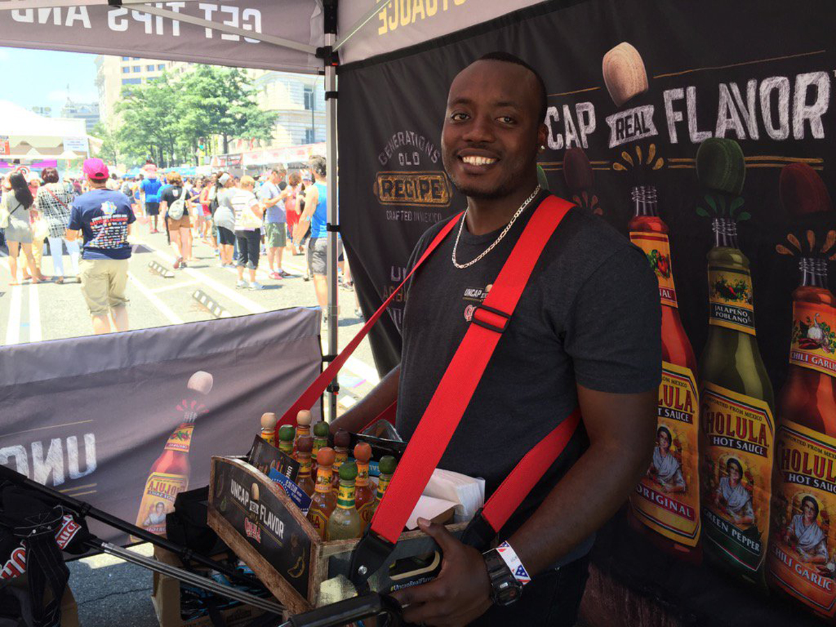 Sebastian Noel attended the Giant National Capital Barbecue Battle to promote Cholula Hot Sauce on Saturday in D.C. (WTOP/Kristi King)