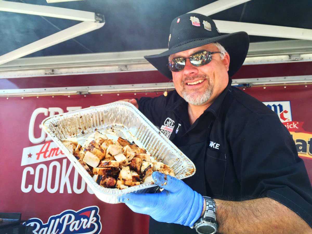 Mike Peters with the Kansas City BBQ Society displays the chicken he cooked up during the Giant National Capital Barbecue Battle on Saturday in D.C. (WTOP/Kristi King)