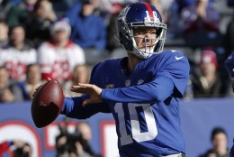 New York Giants quarterback Eli Manning (10) throws a pass during the first half of an NFL football game against the Carolina PanthersSunday, Dec. 20, 2015, in East Rutherford, N.J. (AP Photo/Kathy Willens)