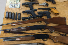 Fourteen firearms were seized in connection to a heroin ring bust in Frederick County, Md. Law enforcement uncovered more than 510 grams of the drug, a street value of about $75,000. (Courtesy Frederick County Sheriff's Office)