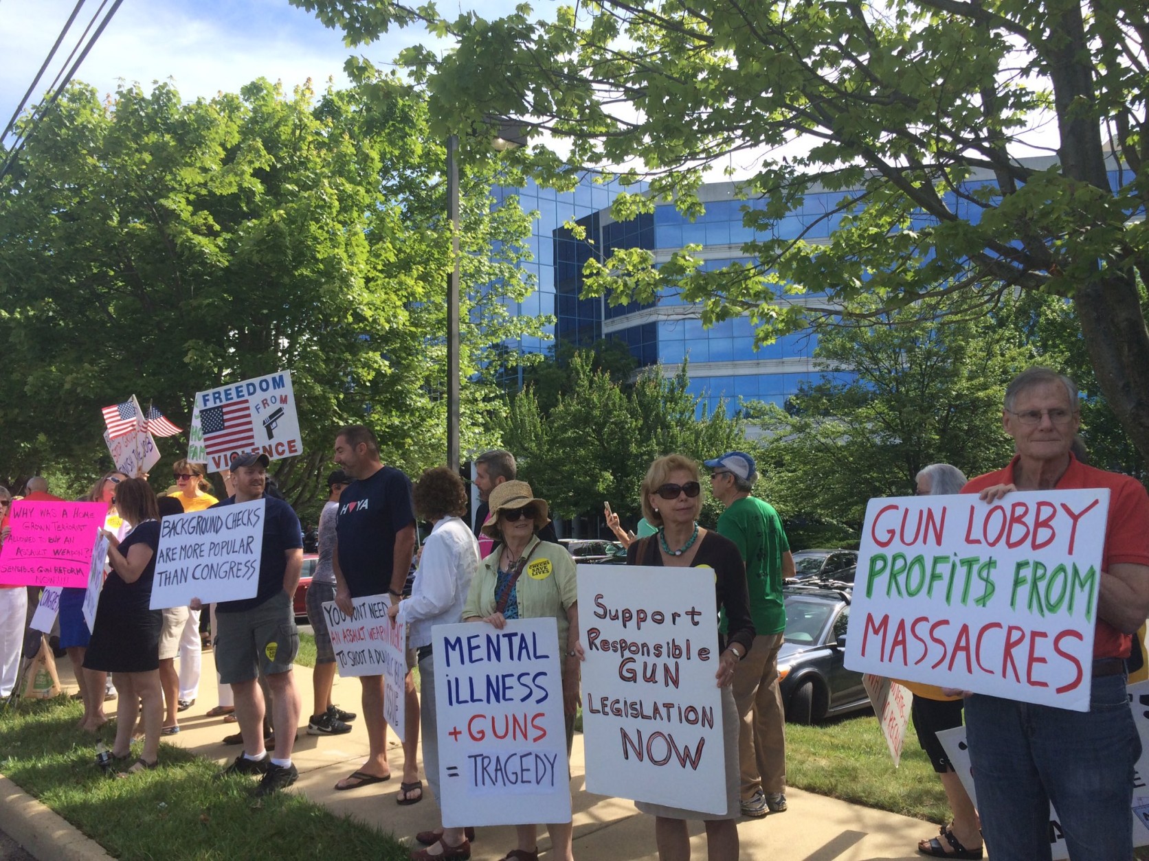 Protesters outside NRA headquarters in Fairfax, Virginia, call for gun control laws. (WTOP/Nick Iannelli)