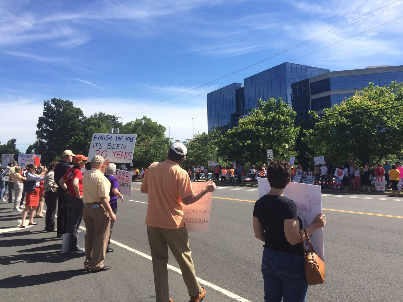 Protesters outside NRA headquarters in Fairfax, Virginia, call for gun control laws. (WTOP/Nick Iannelli)
