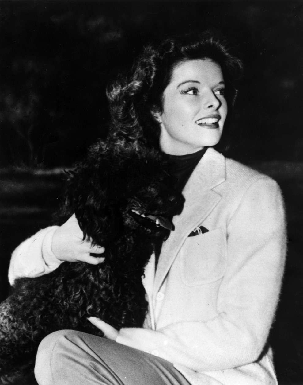 7th April 1938:  Film star Katharine Hepburn (1907 - 2003) with her pet dog.  (Photo by Keystone/Getty Images)