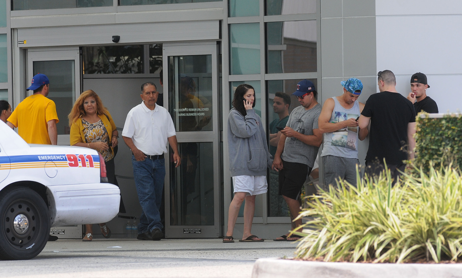 ORLANDO, FLORIDA - JUNE 12:  Families and friends await for information outside of the Orlando Regional Medical Center about loved ones who may have been victims of the mass shooting at the Pulse nightclub on June 12, 2016 in Orlando, Florida. The suspected shooter, Omar Mateen, was shot and killed by police. 50 people are reported dead and 53 were injured in what is now the worst mass shooting in U.S. history. (Photo by Gerardo Mora/Getty Images)