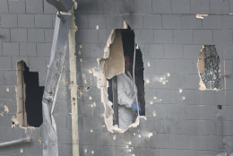 ORLANDO, FL - JUNE 12: An FBI agent is seen through the damaged rear wall of the Pulse Nightclub as he investigates where Omar Mateen allegedly killed at least 50 people on June 12, 2016 in Orlando, Florida. The mass shooting killed at least 50 people and injuring 53 others in what is the deadliest mass shooting in the country's history.  (Photo by Joe Raedle/Getty Images)
