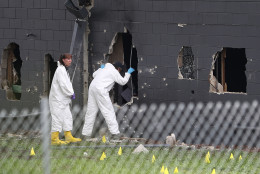 ORLANDO, FL - JUNE 12:  FBI agents investigate near the damaged rear wall of the Pulse Nightclub where Omar Mateen allegedly killed at least 50 people on June 12, 2016 in Orlando, Florida. The mass shooting killed at least 50 people and injuring 53 others in what is the deadliest mass shooting in the country's history.  (Photo by Joe Raedle/Getty Images)