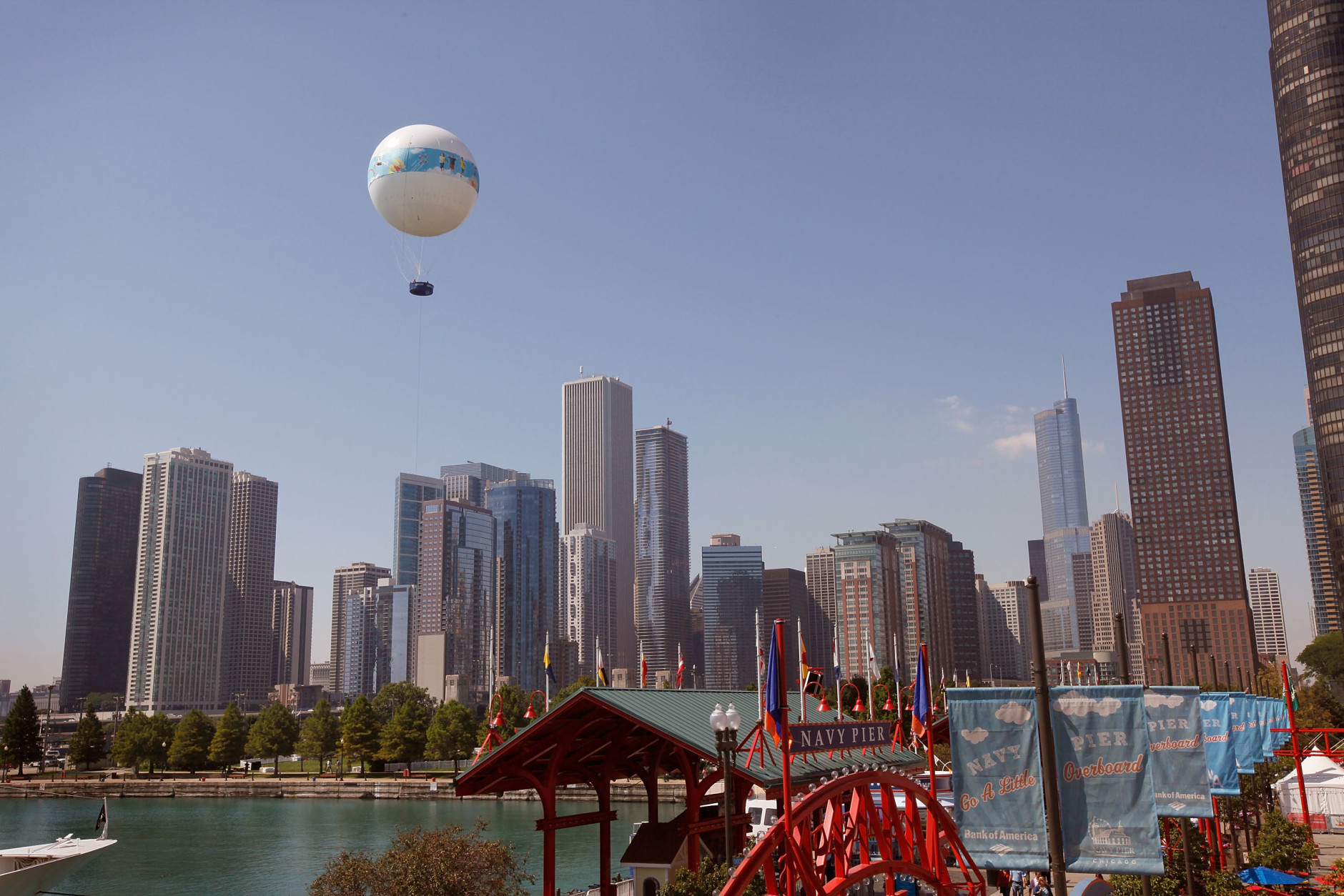 CHICAGO - SEPTEMBER 02:  Passengers get an aerial view of the city while riding the AeroBalloon at Navy Pier September 2, 2009 in Chicago, Illinois.  The helium-filled balloon, which opened for riders today, is tethered to the ground along Chicago's lakefront. The balloon ascends to 350 feet can hold up to 18 passengers.  (Photo by Scott Olson/Getty Images)