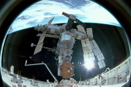 383927 09: FILE PHOTO: The Space Shuttle Atlantis docks with Russia's space station Mir as the tandem orbits Earth above central Canada, November 15, 1995. Mir is nearing the end of its existence as Russia plans to steer the craft out of orbit in late February 2001 in a controlled crash to dump the space station safely into the Pacific Ocean. (Photo by NASA/Newsmakers)