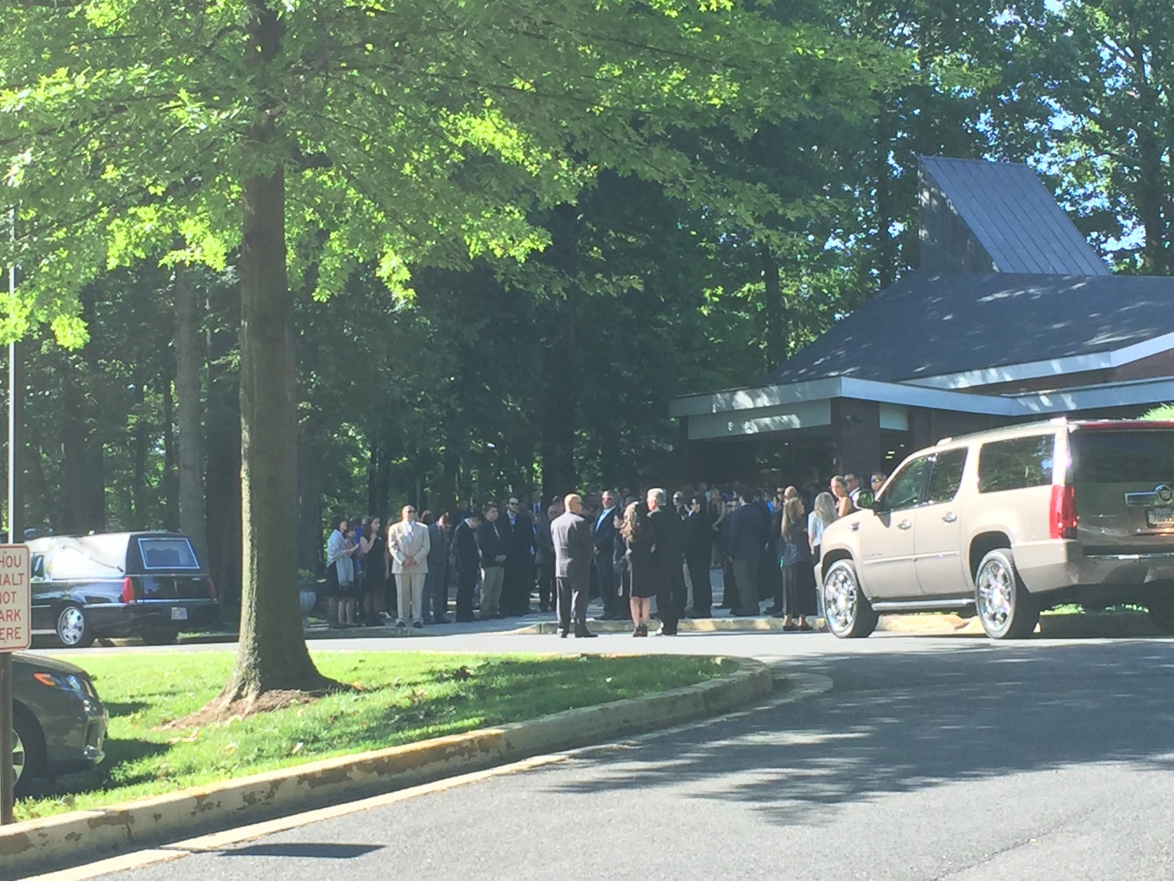Family and friends pay their respects at the funreal of Patrick Shifflett on Monday. (WTOP/Rich Johnson)