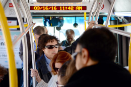In this WTOP file photo, riders fill the center aisle of a crowded Metrobus on Wisconsin Avenue on Wednesday, March 16, 2016. (WTOP/Dave Dildine)