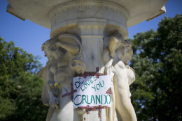 A sign is posted on the fountain at Dupont Circle in support of the victims of the massacre at a Orlando nightclub, after LGBT pride festival organizers held a moment of silence for shooting victims, Sunday, June 12, 2016 in Washington. Local law enforcement officials are beefing up security for Sunday's Capital Pride Festival in D.C. Officials said the shooting at the Orlando nightclub was the worst mass shooting in American history. (AP Photo/Pablo Martinez Monsivais)