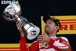 Ferrari driver Sebastian Vettel of Germany holds his third place trophy on the podium of the Spanish Formula One Grand Prix at the Barcelona Catalunya racetrack in Montmelo, just outside Barcelona, Spain, Sunday, May 15, 2016. (AP Photo/Manu Fernandez)