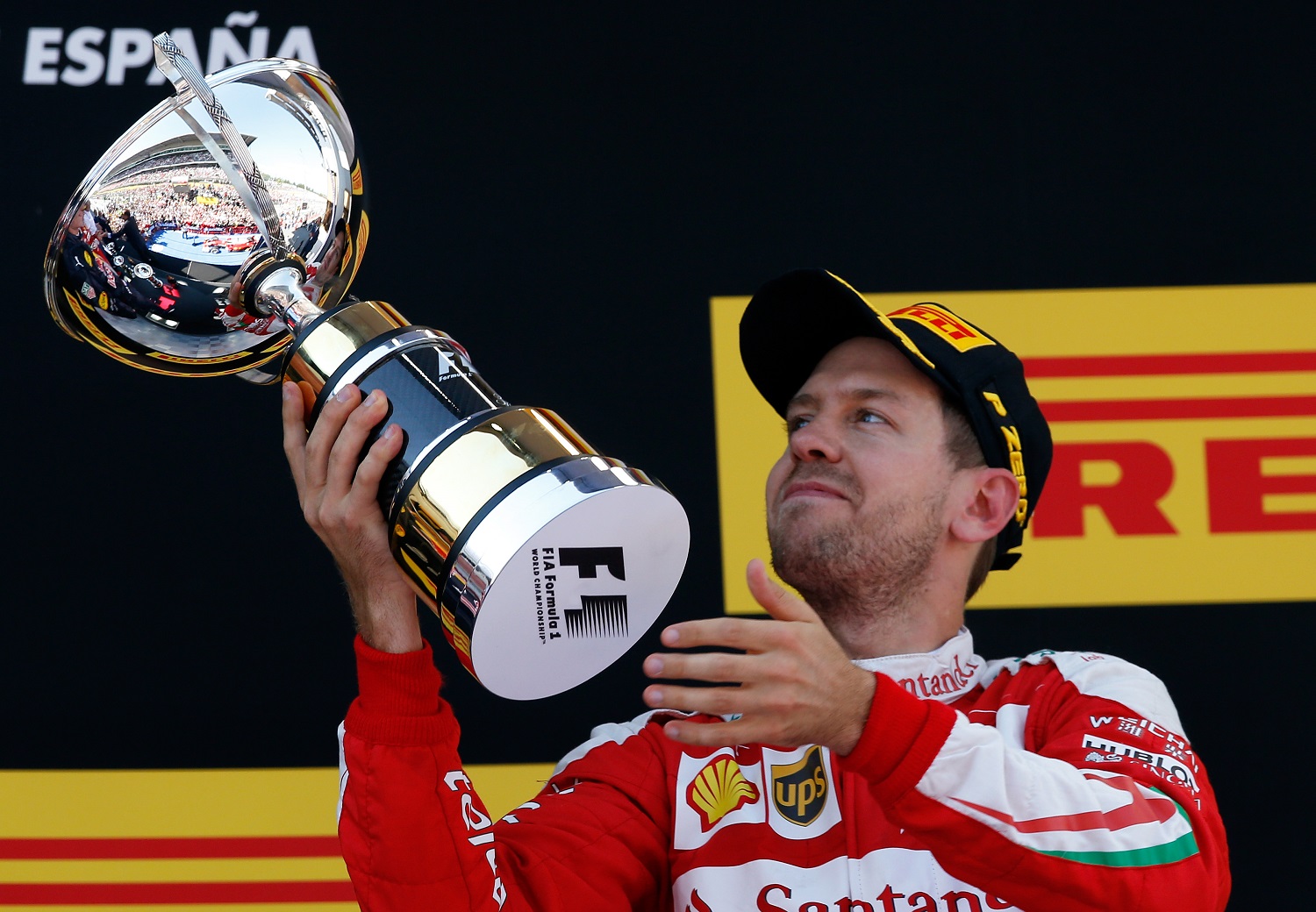 Ferrari driver Sebastian Vettel of Germany holds his third place trophy on the podium of the Spanish Formula One Grand Prix at the Barcelona Catalunya racetrack in Montmelo, just outside Barcelona, Spain, Sunday, May 15, 2016. (AP Photo/Manu Fernandez)
