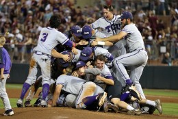 Members of the TCU baseball team dog pile on the pitchers mound after beating Texas A&amp;M 4-1 in a NCAA college baseball Super Regional tournament game, Sunday, June 12, 2016, in College Station, Texas. (AP Photo/Sam Craft)