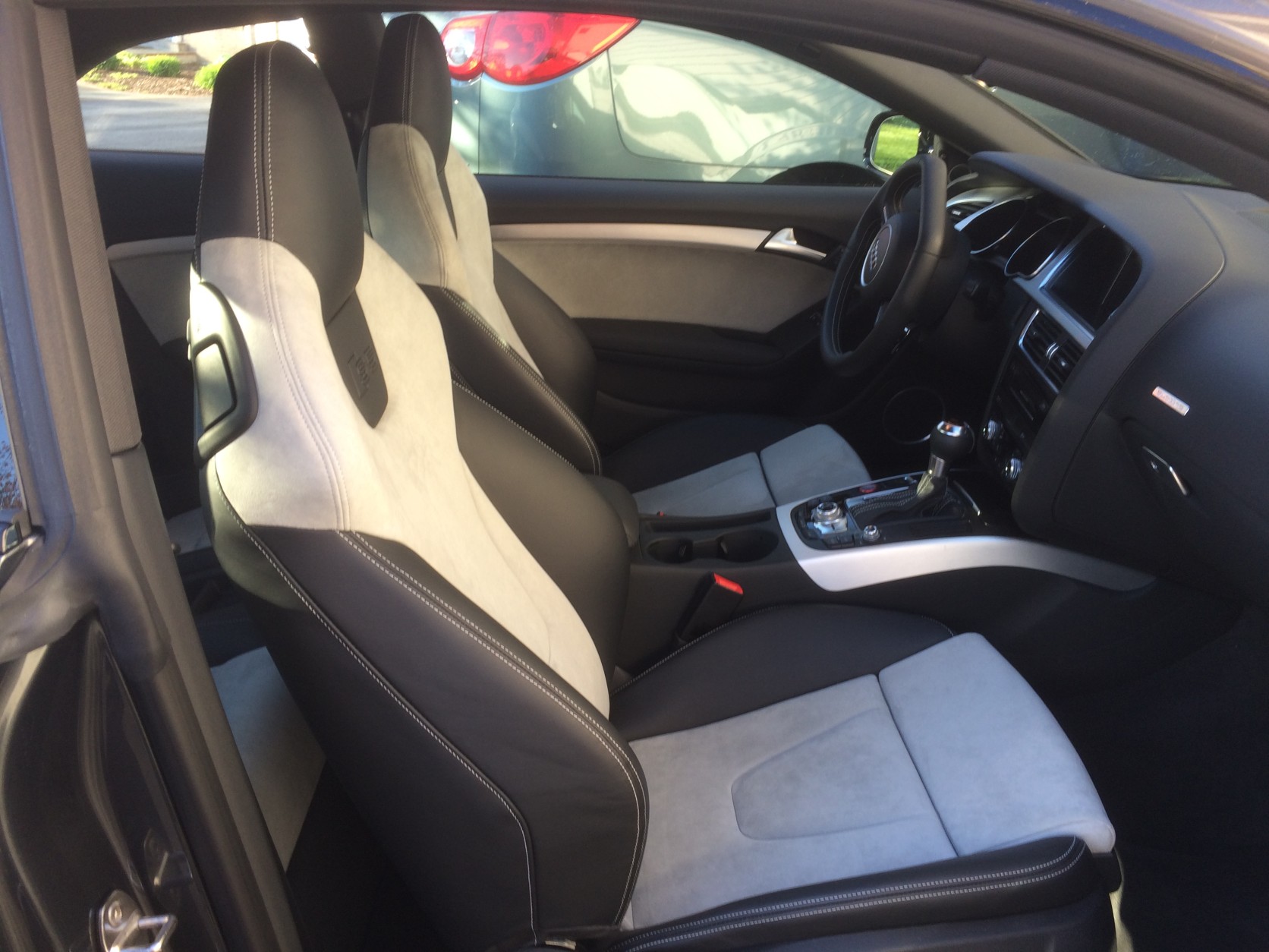 The front seats are leather with good-looking Alcantara inserts. (WTOP/Mike Parris)