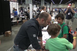 Tom King, the writer for DC Comics' "Batman" greets fans at Awesome Con in D.C. (WTOP/Steve Winter)