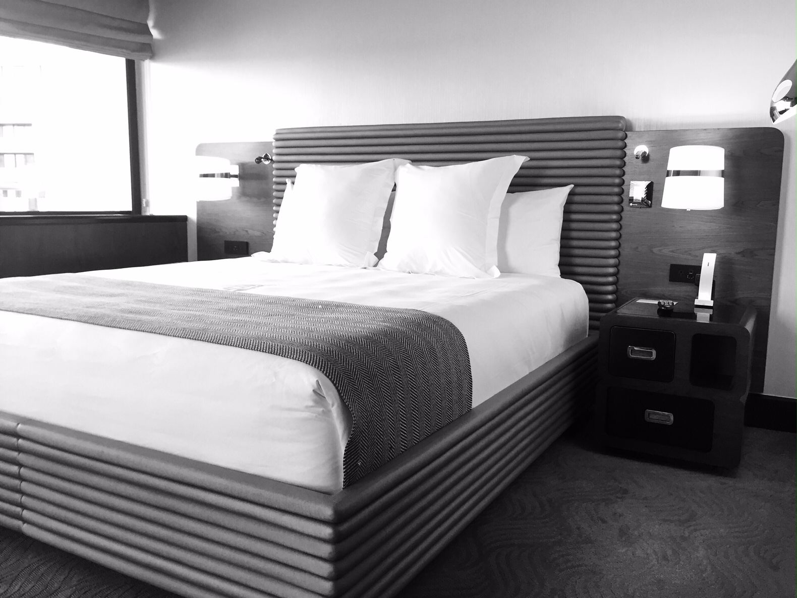 Plush bedding and extraordinary views are part of the newly-renovated Watergate experience. (WTOP/Neal Augenstein)