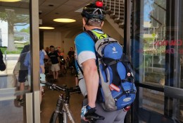 Attendees arrive for the Great Montgomery Bike Summit at Montgomery County Council headquarters in Rockville, Md. on Saturday, July 18, 2016. (WTOP/Kathy Stewart)