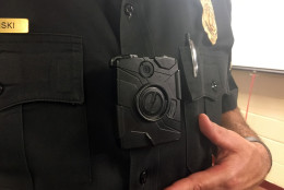 Captain Mark Plazinski with the Montgomery County Police Department showcases the department's body cameras. (WTOP/Mike Murillo)