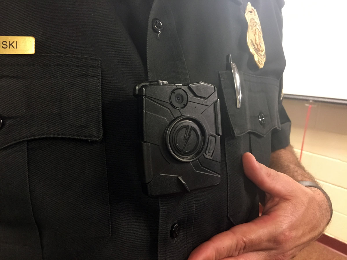 Captain Mark Plazinski with the Montgomery County Police Department showcases the department's body cameras. (WTOP/Mike Murillo)
