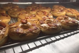 Bacon maple doughnuts at Sugar Shack Donuts on National Doughnut Day, June 3. WTOP's Neal Augenstein is at his third stop to find the best doughnuts in the area.(Neal Augenstein/WTOP)