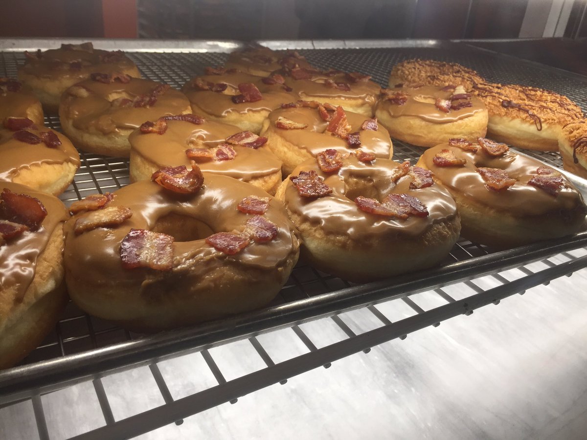 Bacon maple doughnuts at Sugar Shack Donuts on National Doughnut Day, June 3. WTOP's Neal Augenstein is at his third stop to find the best doughnuts in the area.(Neal Augenstein/WTOP)