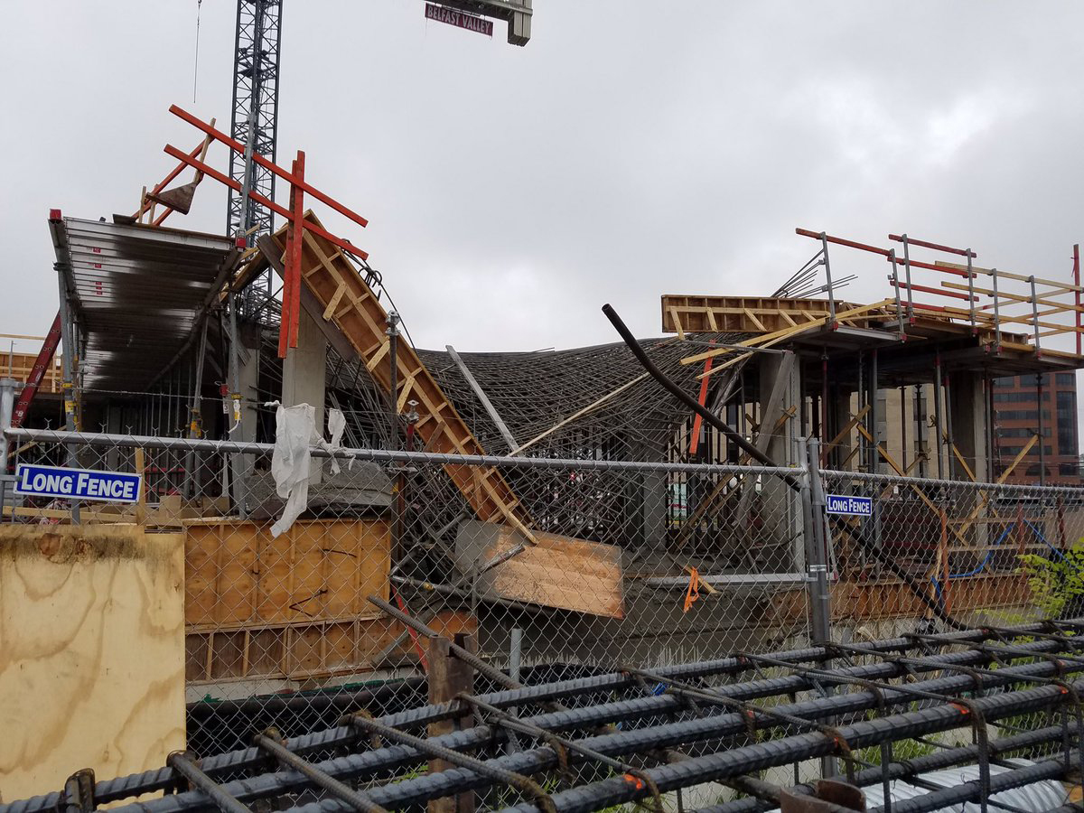 Workers were pouring concrete at a construction site when a deck collapsed at around 8:45 a.m. Saturday in Rockville, Md. (Courtesy Twitter/Pete Piringer)