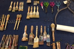Tools of the trade: an assortment of brushes for the workshops Akerele hosts at her shop. (Kate Ryan/WTOP)