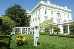 First lady Laura Bush gives a tour of the Jacqueline Kennedy Garden at the White House for members of the media Friday, April 16, 2004 in Washngton. (AP Photo/Manuel Balce Ceneta)