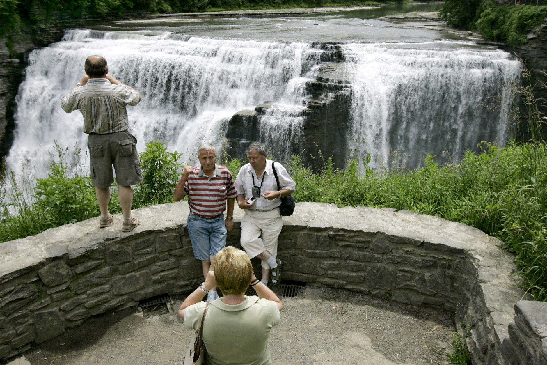 ** FOR IMMEDIATE RELEASE **Tourists from the Czech Republic photograph the Middle Falls during a bus tour at Letchworth State Park in Castile, N.Y., Wednesday, June 21, 2006. Letchworth State Park is one of New York's oldest and largest nature preserves. (AP Photo/David Duprey)