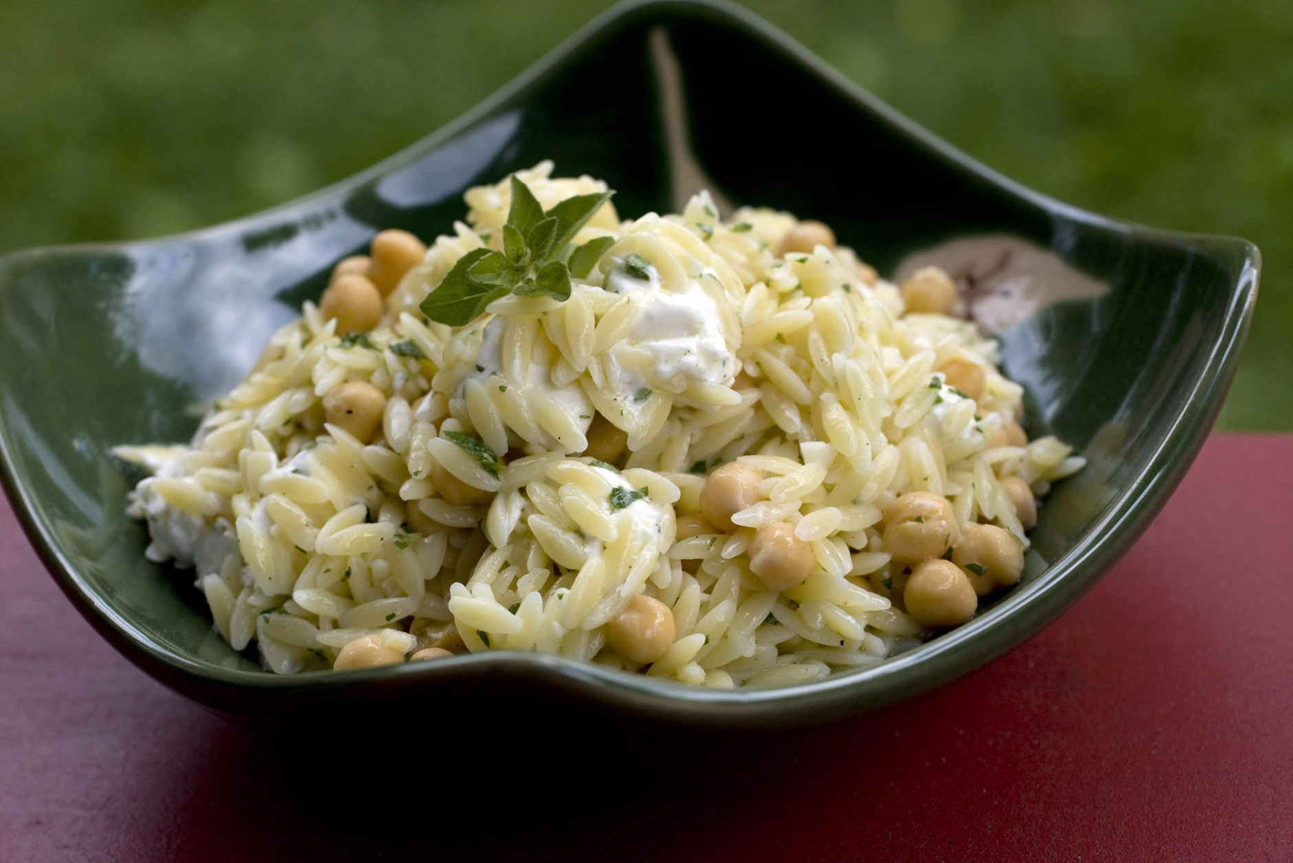 **FOR USE WITH AP LIFESTYLES**   This Sunday, June 1, 2008 photo shows a bowl of Orzo with Chickpeas. This simple dish is a Mediterranean take on pasta salad, blending rice-like orzo pasta with chickpeas and goat cheese. It can be served warm or at room temperature.   (AP Photo/Larry Crowe)