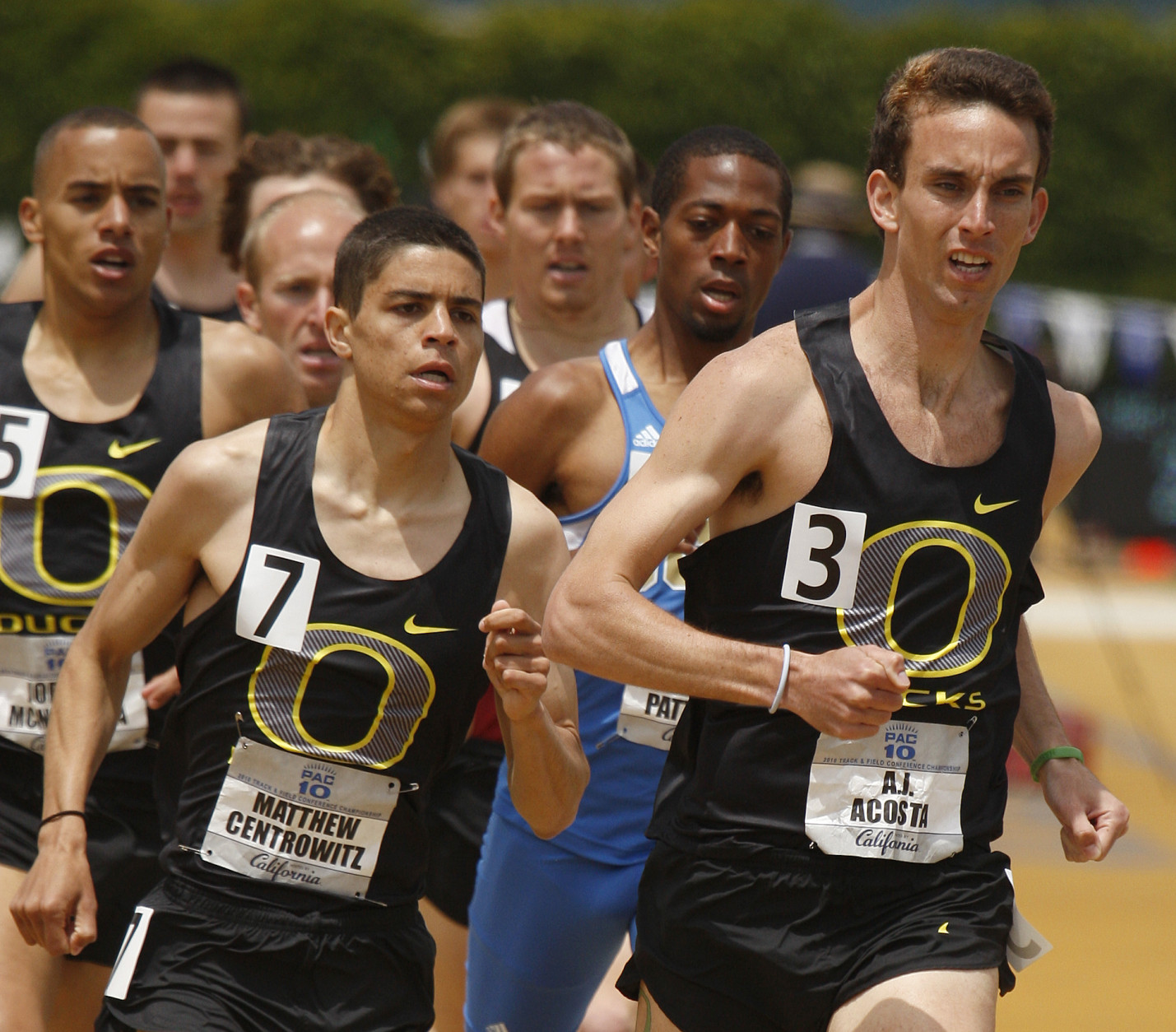Oregon's A.J. Acosta, right, runs beside teammate Matthew Centrowitz (7) in the men's 1,500 meters Sunday, May 16, 2010, during the Pac-10 track and field championships in Berkeley, Calif. Centrowitz and Acosta finished first and second, respectively. (AP Photo/Ben Margot)