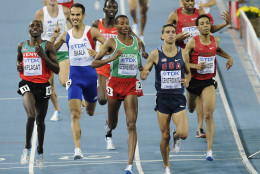 USA's Matthew Centrowitz, second from right, crosses the finish line ahead of Ethiopia's Mekonnen Gebremedhin, third from right, Kenya's Silas Kiplagat, left, France's Mehdi Baala, second from left and Morocco's Abdalaati Iguider to win a Men's 1500m semifinal at the World Athletics Championships in Daegu, South Korea, Thursday, Sept. 1, 2011. (AP Photo/Martin Meissner)