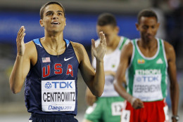 USA's Matthew Centrowitz, left, reacts after placing third in a Men's 1500m final at the World Athletics Championships in Daegu, South Korea, Saturday, Sept. 3, 2011. (AP Photo/Lee Jin-man)