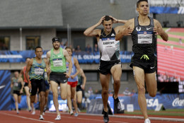 Matthew Centrowitz, right, beats Robby Andrews in the finals of the men's 1500-meter run at the U.S. Olympic Track and Field Trials, Sunday, July 10, 2016, in Eugene Ore. (AP Photo/Marcio Jose Sanchez)