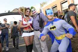 Costumed fans pose for the crowds in the street on day three of the Comic-Con International held at the San Diego Convention Center Saturday July 23, 2016 in San Diego.  (Photo by Denis Poroy/Invision/AP)